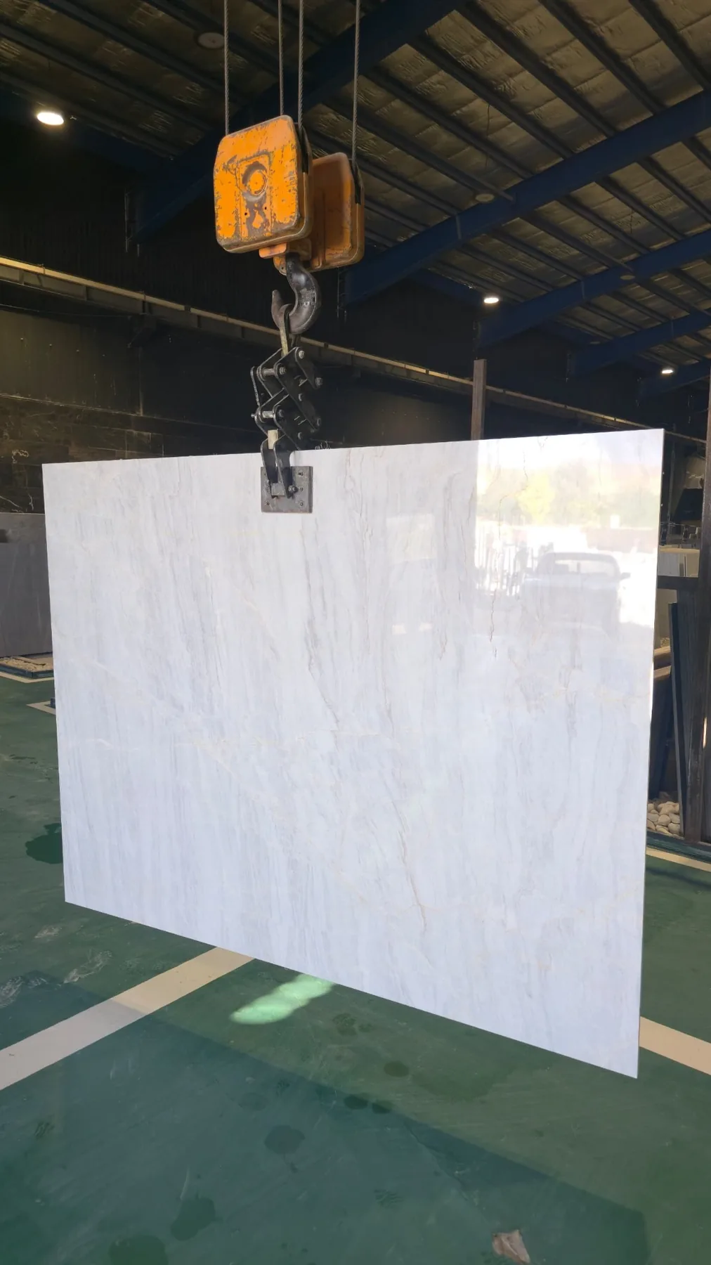 Large marble slab during factory handling